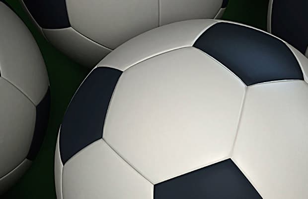 Illustration von drei Fußbällen im Anschnitt.